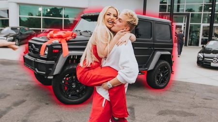 jake carrying tana infront of the mercedes G-wagon jake got for tana 